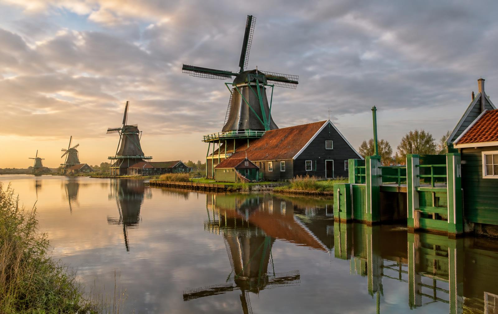 Traditional green wooden houses and windmills at Zaanse Schans, Netherlands